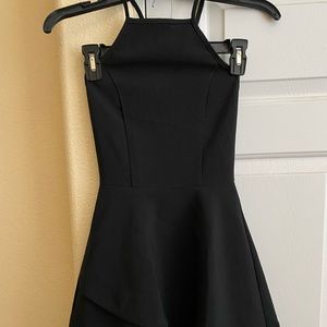 Black cross back flared dress with ruffle